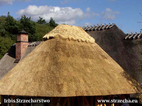 A garden gazebo with an English ridge, straw woven hazel