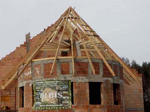 Thatching: a wooden roof construction on a semi-circular building