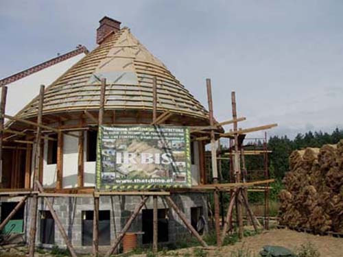 Reed roof: a wooden roof construction with a windproof membrane and patched with patches