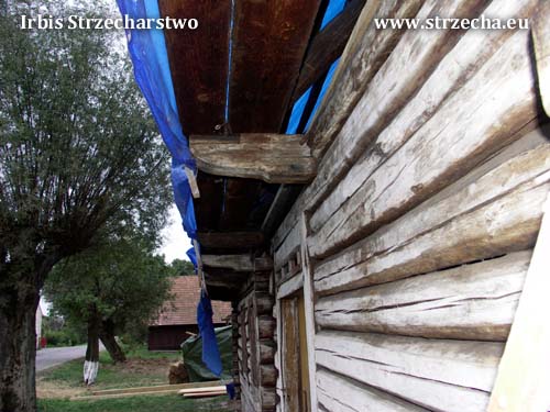 An antique wooden cottage, made in coronal technology, on the dovetail with shrovetide